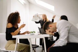 Employees in a stressful-looking work environment