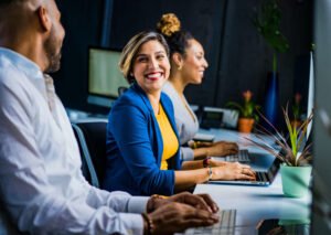 Employees smiling, having conversation