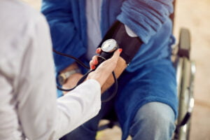 Doctor taking the blood pressure of a patient