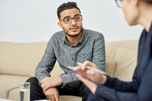 Young male having a conversation with therapist 