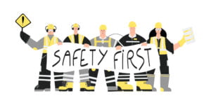Graphic of construction workers holding 'safety first' sign