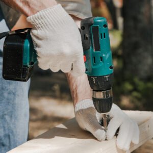Male hand holding a drilling tool