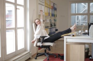 Female employee taking a break from work and stretching