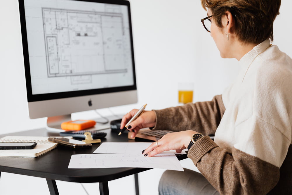 Female employee working in front of computer screen