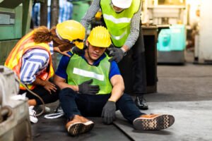 Construction workers helping an injured colleague