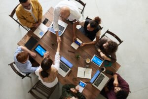 Employees sitting around a table in an office