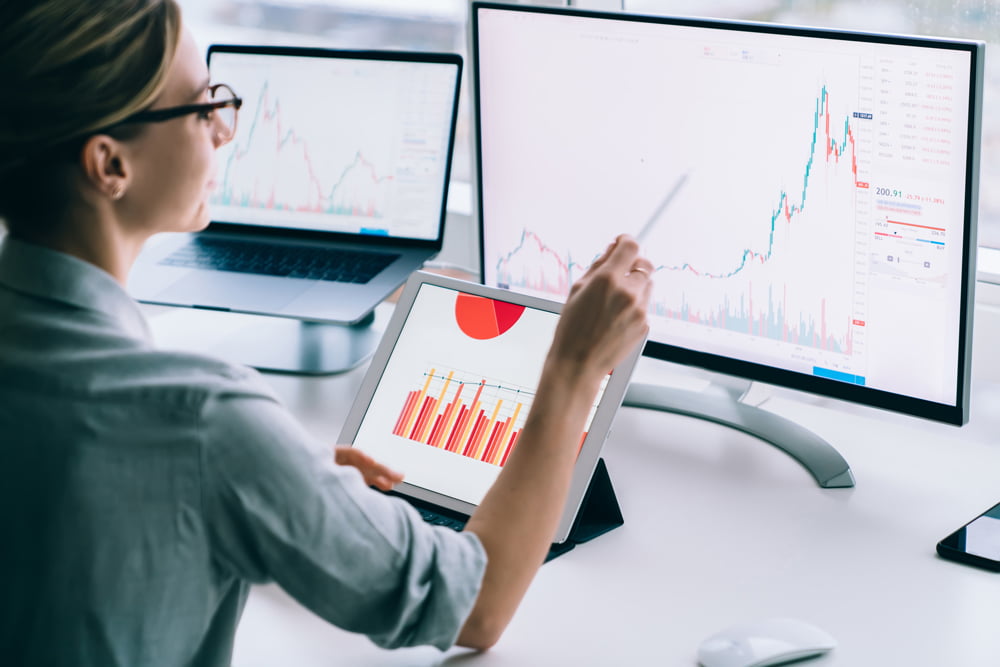 Female analyst comparing two sets of data
