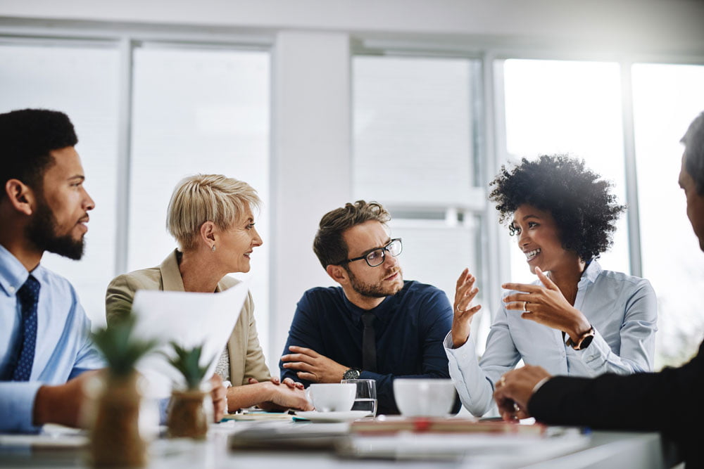 A group of businesspeople sitting together during a meeting.