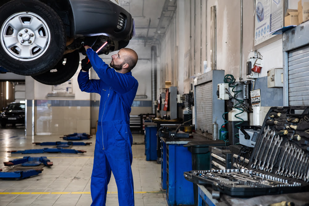 Male worker repairing a vehicle 