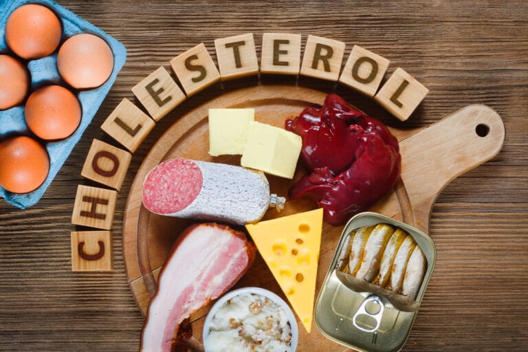 image with cholesterol written over the food.
