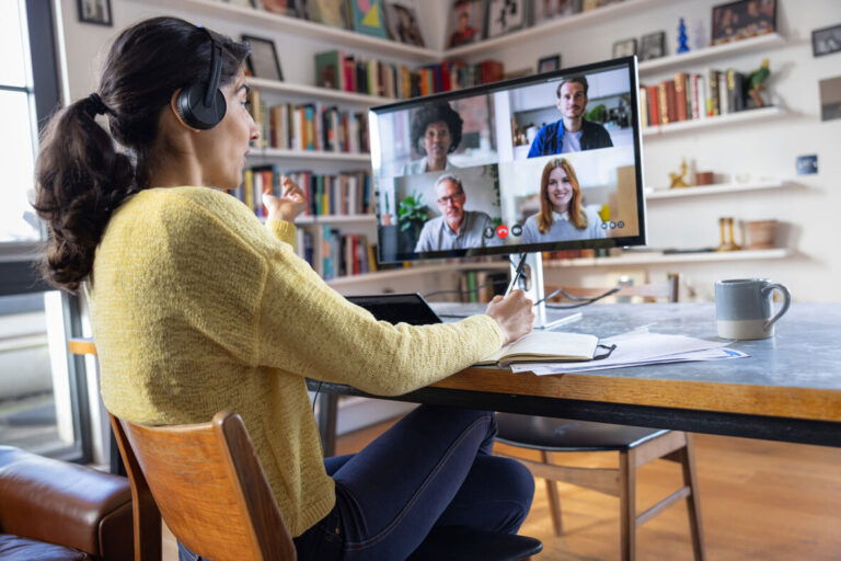 a lady sitting incorrectly for meeting from work from home.