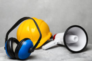 Audiometry test and surveillance with headphones, speaker and a safe hat.