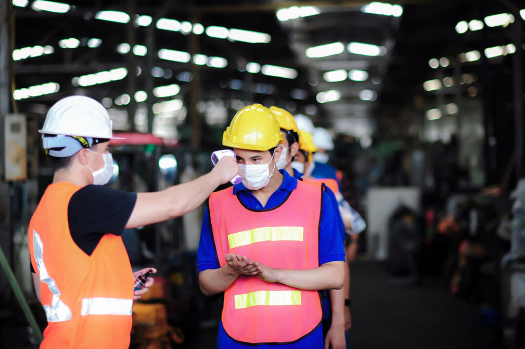 Workplace health surveillance with temperature checking.